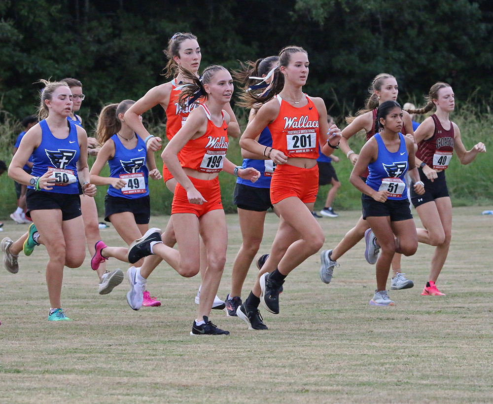 Sophomore Grace Gosline of Arab (left) and freshman Reagan Parris of Bremen compete during the JSU Foothills Invitational at Choccolocco Park in Oxford on Aug. 30. 